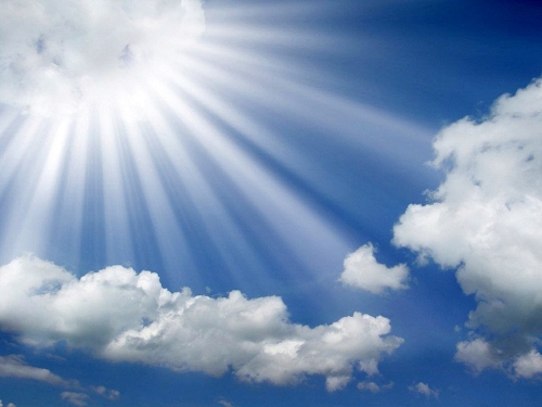 sun-rays-coming-out-of-the-clouds-in-a-blue-sky-wallpaper_edited-1